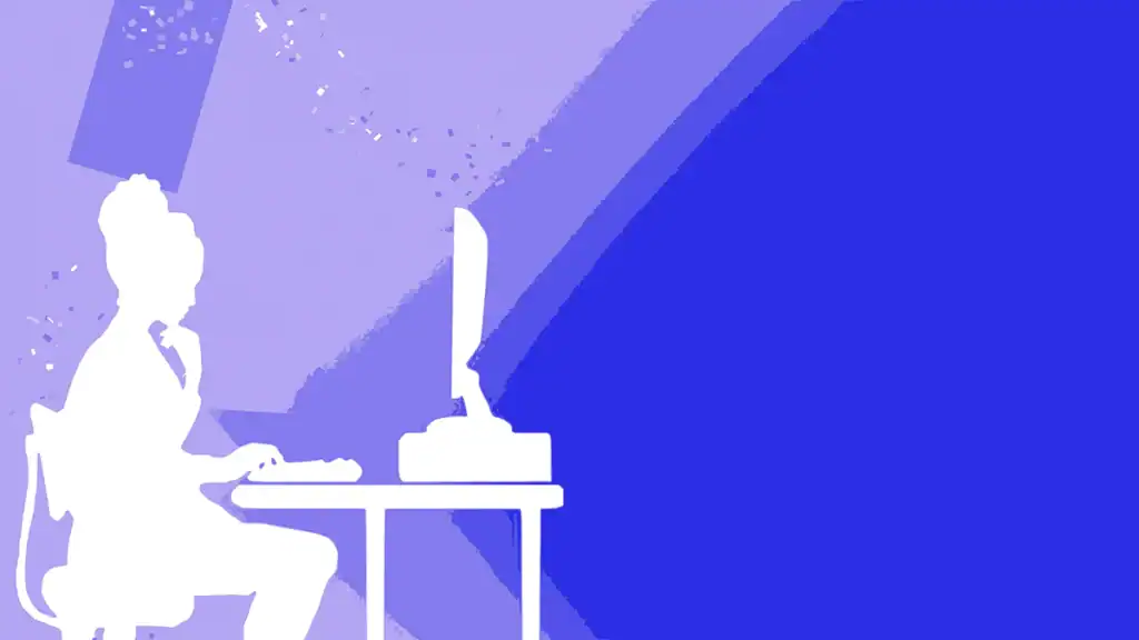 Silhouette of woman working on a computer in a modern office setting.